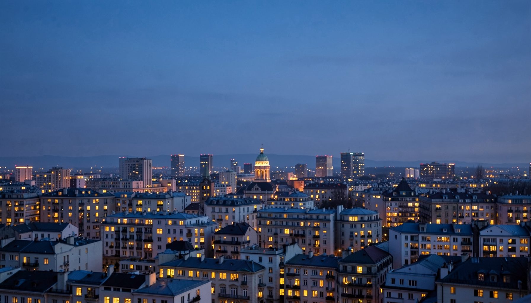 A city skyline at dusk with soft indigo and warm window-light tones, suggesting transatlantic ambition